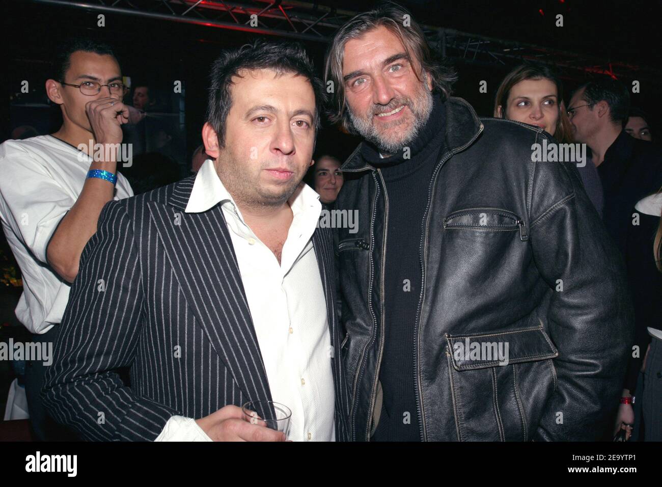 French humorist, movie director and cast member Michel Muller (L) with cast member Pierre-Ange Le Pogam at the after party for the premiere of Muller's movie, 'La vie de Michel Muller est plus belle que la votre', at L'Etoile in Paris, France, on January 24, 2005. Photo by Benoit Pinguet/ABACA. Stock Photo