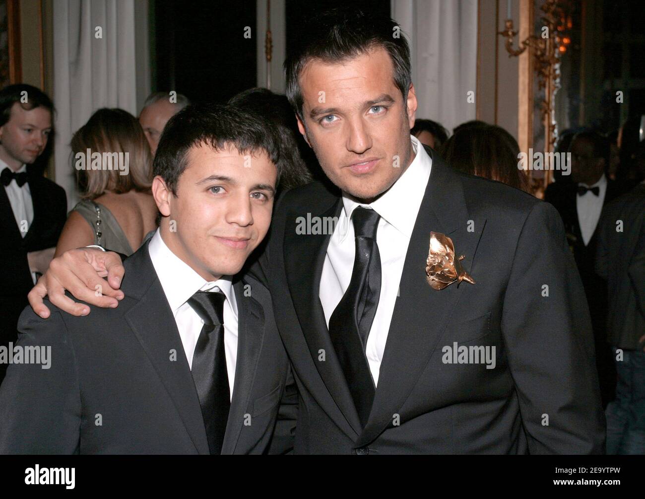 Algerian born rai singer Faudel (L) and former singer Brian (ex-'Alliage') attend the Haute-Couture Ball organized by Lebanese fashion designer Elie Saab at La Maison Baccarat in Paris, France, on January 24, 2005. Photo by Benoit Pinguet/ABACA. Stock Photo