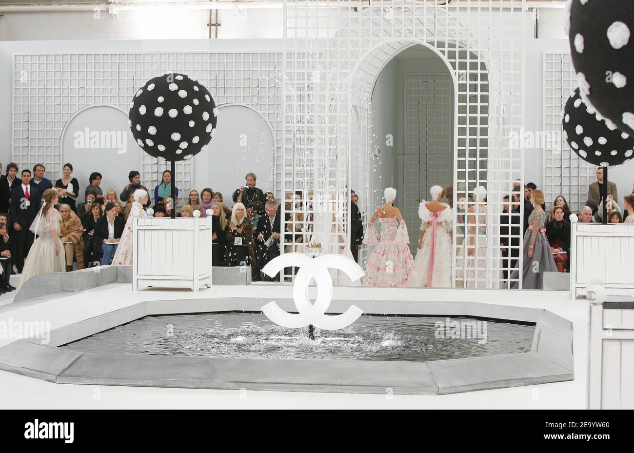 German designer Karl Lagerfeld flanked by models on the runway of the Chanel Haute-Couture Spring-Summer 2005 collection presentation in Paris, France, January 25, 2005. Photo by Java/ABACA Stock Photo