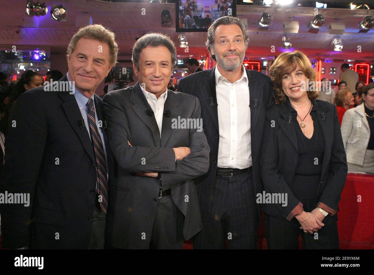 TV journalists Robert Namias (L) and his wife Anne Barrere (R) attend the taping of Michel Drucker's talk show Vivement Dimanche special Michel Leeb (second right) on January 26, 2005. Photo by Jean-Jacques Datchary/ABACA Stock Photo