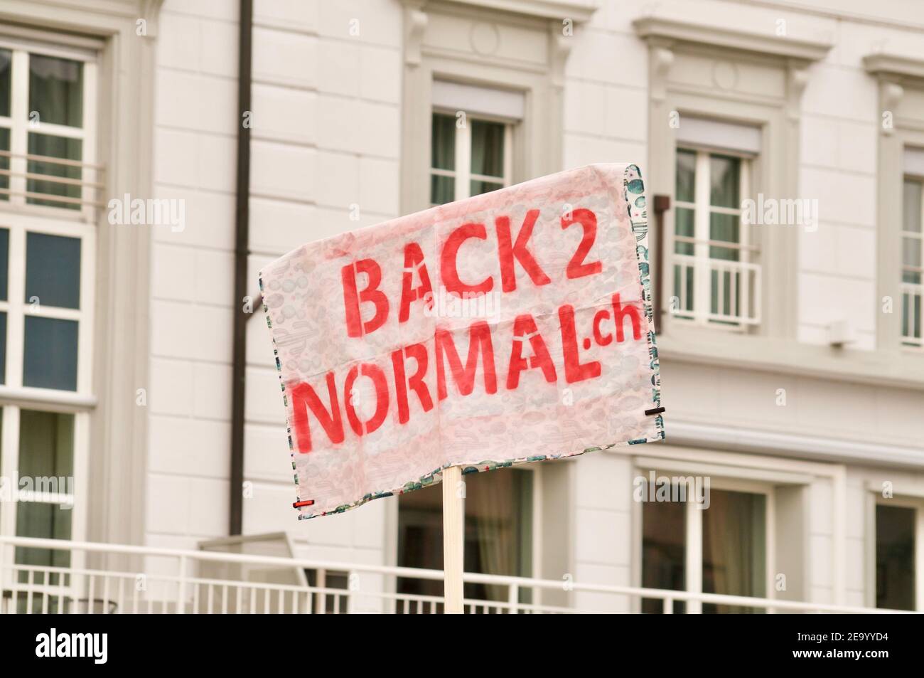 Zug, Switzerland - 6th February 2021 : Back to normal protest sign against Corona Virus measures and human rights in the city of Zug, Switzerland Stock Photo