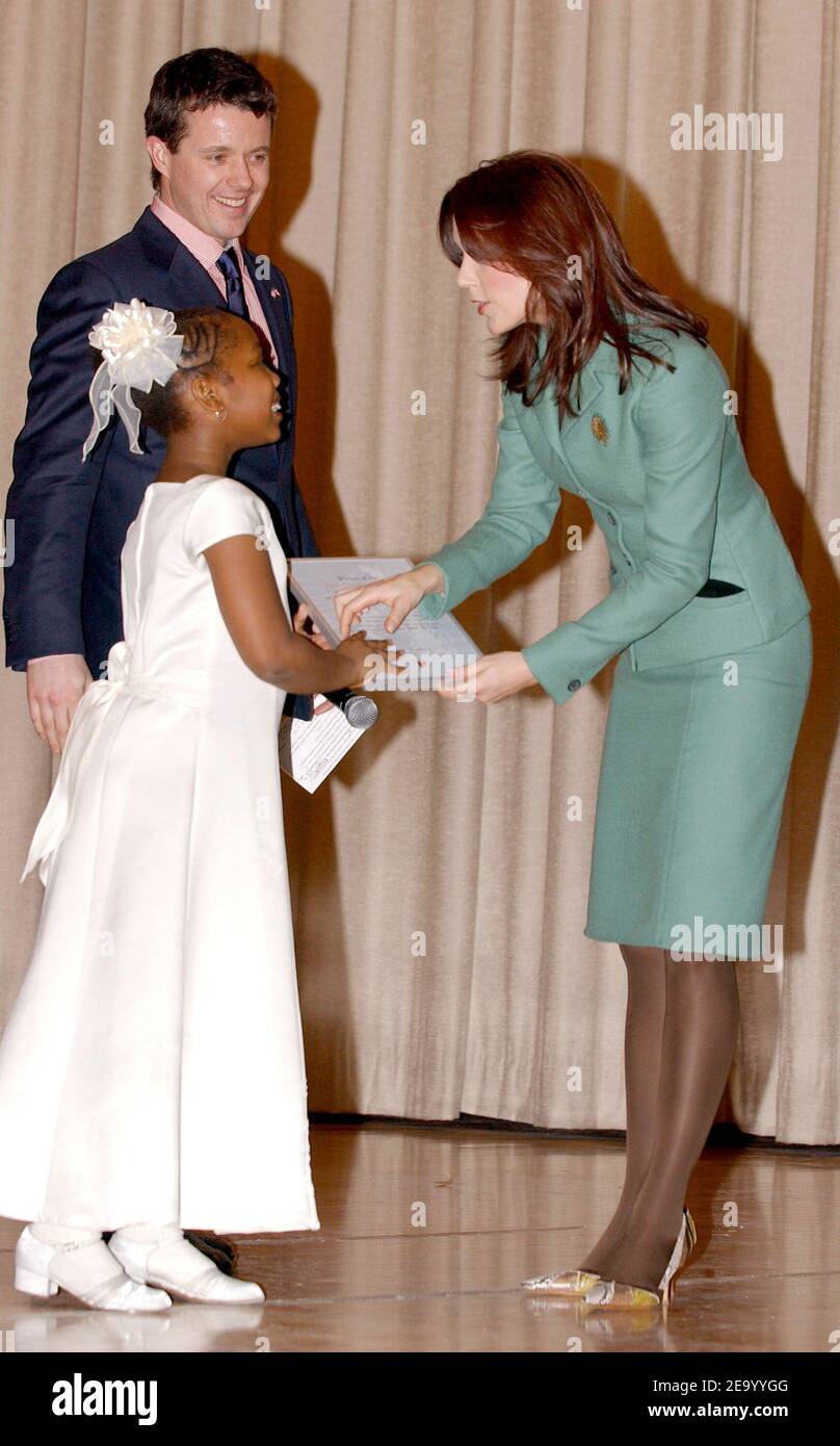 Reagan Walker (8 y.o.) is awarded (for her story telling skills) an invitation to attend the Hans Christian Andersen bicentenial celebrations in Copenhagen, Denmark by HRH Crown Prince Frederik of Denmark and his wife Crown Princess Mary of Denmark (Mary Elizabeth Donaldson) as they visited PS 144 Hans Christian Andersen Public School in Harlem, on the third day of their official visit to New York, on Tuesday, February 1, 2005. (Pictured : Frederik of Denmark, Mary of Denmark, Mary Donaldson, Reagan Walker). Photo by Nicolas Khayat/ABACA. Stock Photo