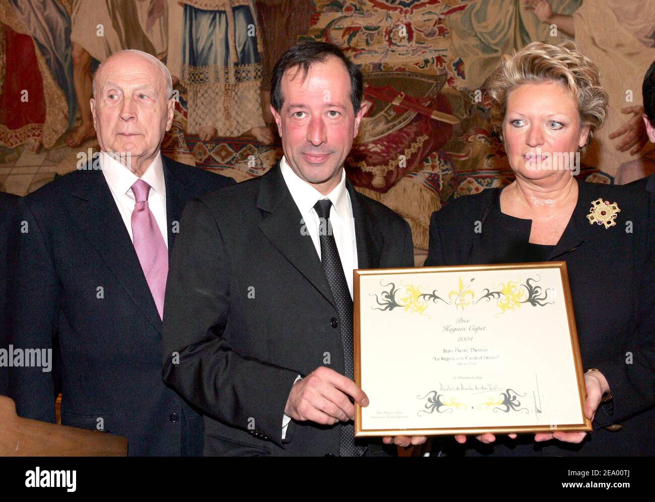 French historian Jean-Pierre Thomas (C) is awarded with the '2004 Hugues Capet Prize' from Pierre-Christian Taittinger and the Princess Beatrice de Bourbon des Deux Siciles for his book 'Le Regent et le Cardinal Dubois', during a ceremony held at the Cercle de l'Union Interalliee in Paris, France on February 7, 2005. Photo by Laurent Zabulon/ABACA. Stock Photo