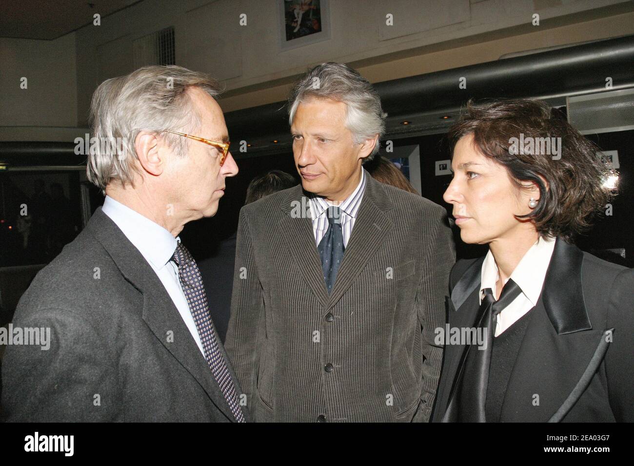 French Interior Minister Dominique de Villepin (C) with editor Olivier Orban and his wife, author Christine Orban attend the Cellboost party for mobile phone accessories organized by Worldline Communications at the VIP Room in Paris, France, on February 17, 2005. Photo by Benoit Pinguet/ABACA. Stock Photo