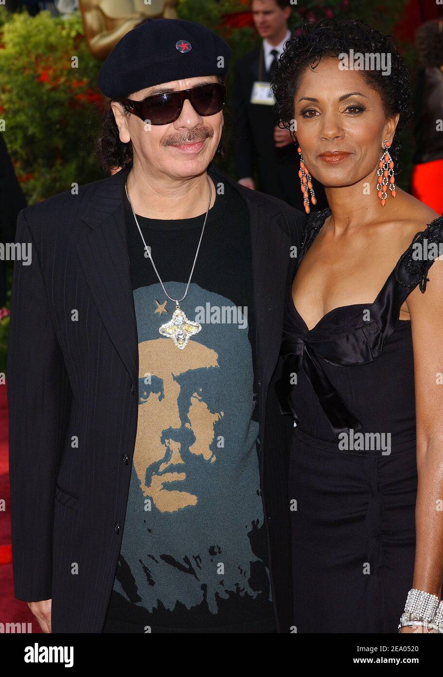 Carlos Santana and wife Debra arrive at the 77th Annual Academy Awards held at the Kodak Theater in Hollywood, CA on February 27, 2005. Photo by Hahn-Khayat-Nebinger/ABACA Stock Photo