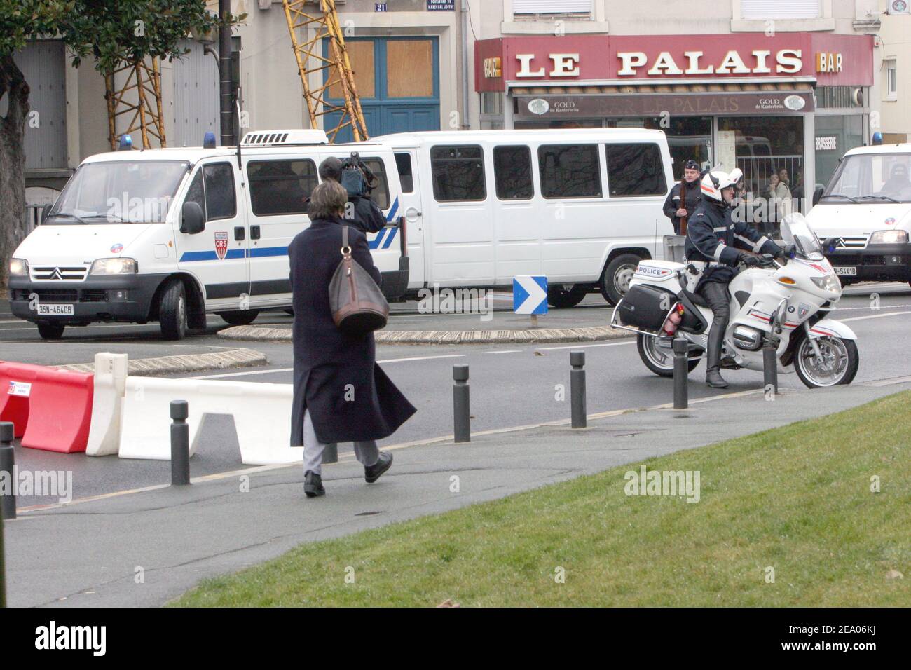 Police vans bring defendants to the courthouse of Angers, western France,  on March 3, 2005, where one of the largest trial ever in modern French  history opened today. Sixty-six men and women