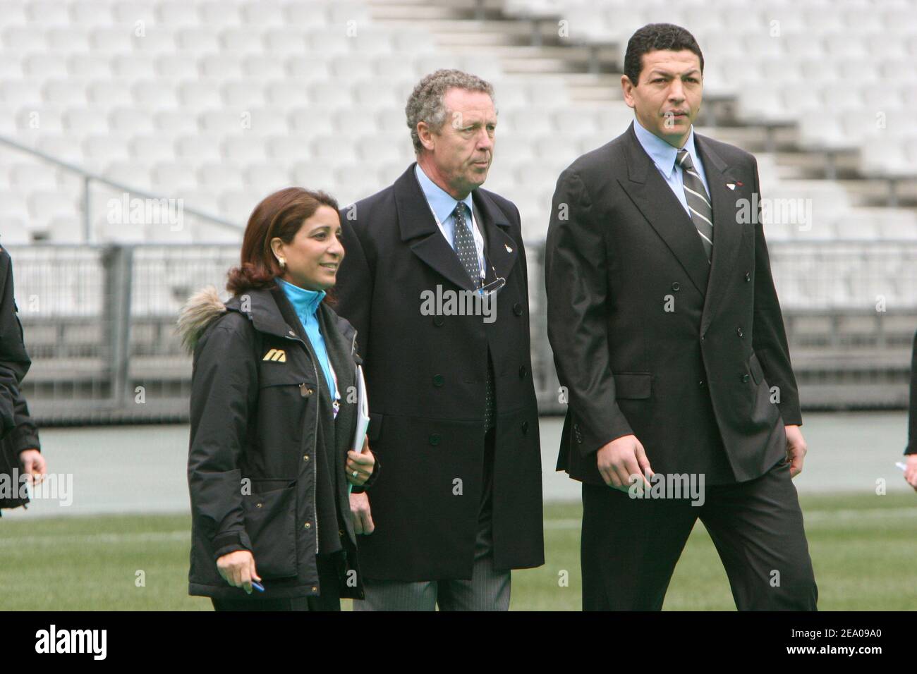 President of the International Olympic Committee's evaluation commission Nawal El Moutawakel and Guy Drut and Abdelatif Benazzi visit the Stade de France in Saint-Denis near Paris on March 10, 2005. Photo by Mousse/ABACA. Stock Photo