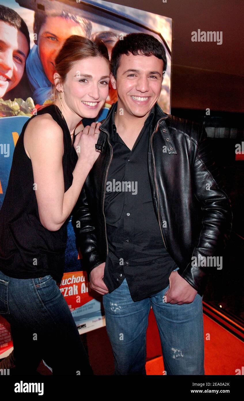 French actors and cast members Julie Gayet and Faudel attend the premiere of the movie 'Bab El Web' in Paris on March 14, 2005. Photo by Bruno Klein/ABACA. Stock Photo