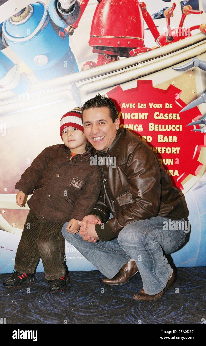 French rai singer Faudel and his son Enzy attend the French premiere of the animation movie 'Robots' held at UGC Normandie cinema in Paris, France on March 29, 2005. Photo by Laurent Zabulon/ABACA. Stock Photo
