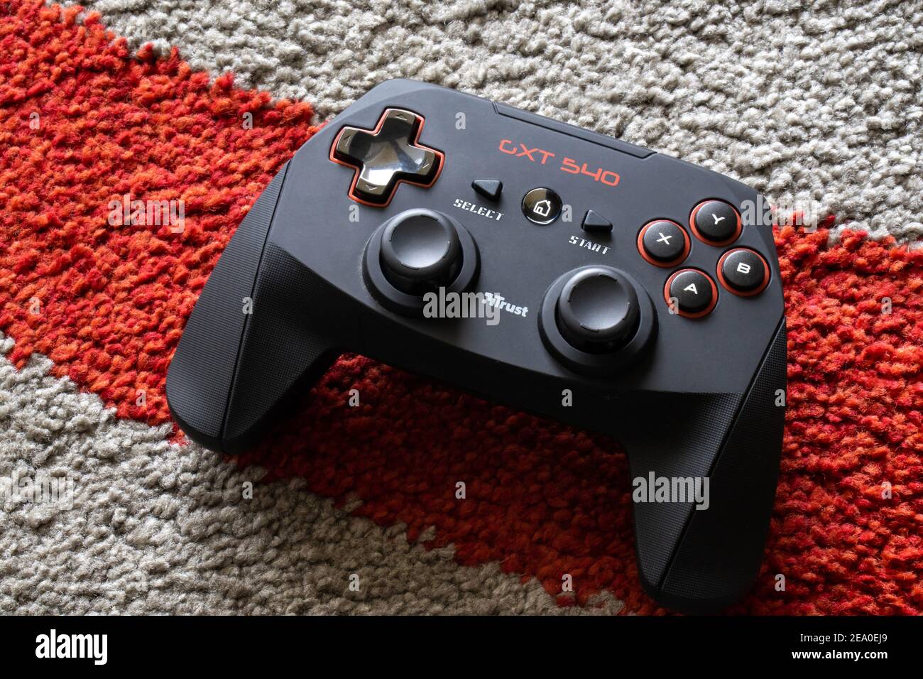 Black and red macro game controller on red line background. Gaming joystick  for computer and console closeup. Button and analog on futuristic gamepad  Stock Photo - Alamy