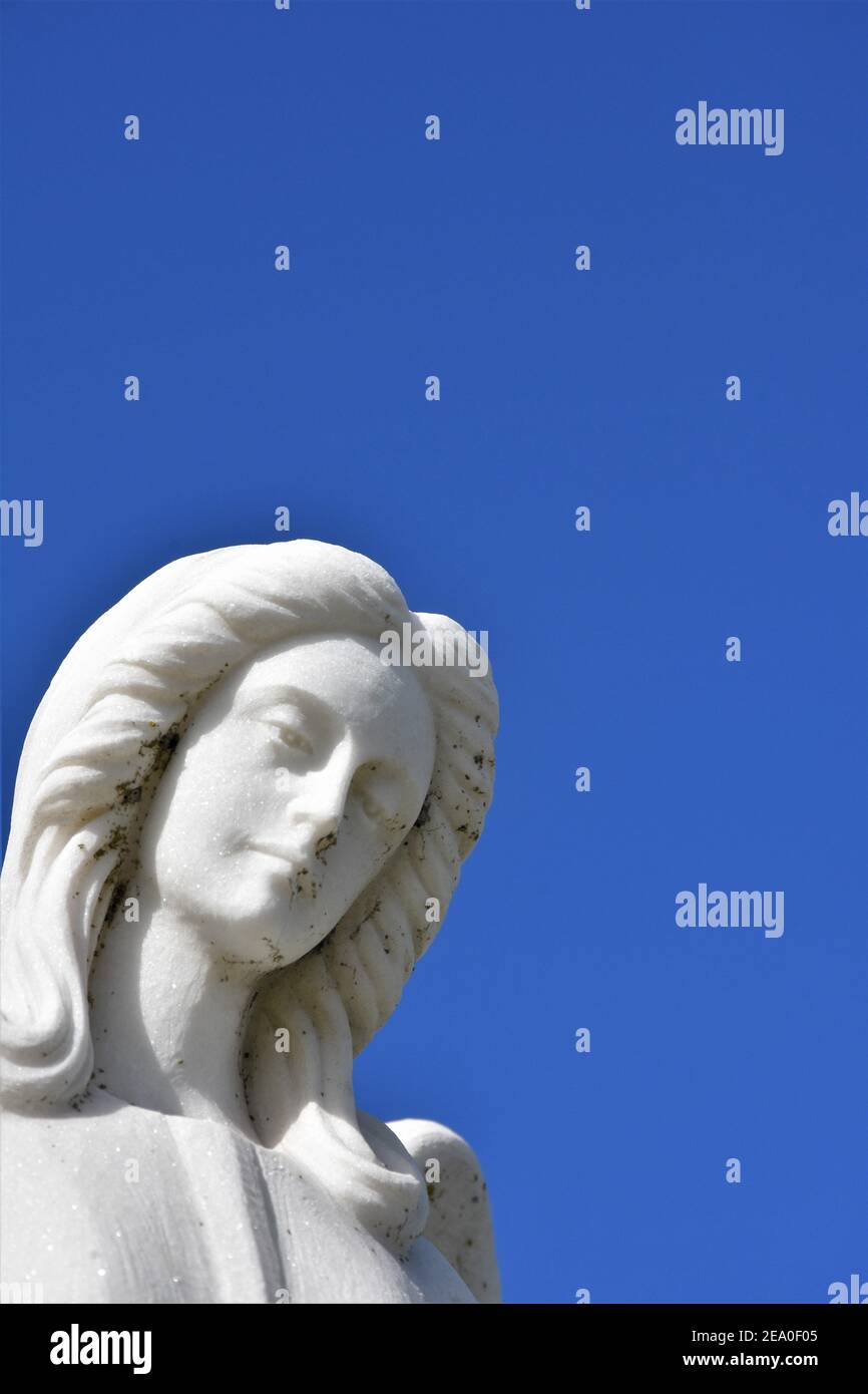 Angel statues in a California Catholic public cemetery with open sky