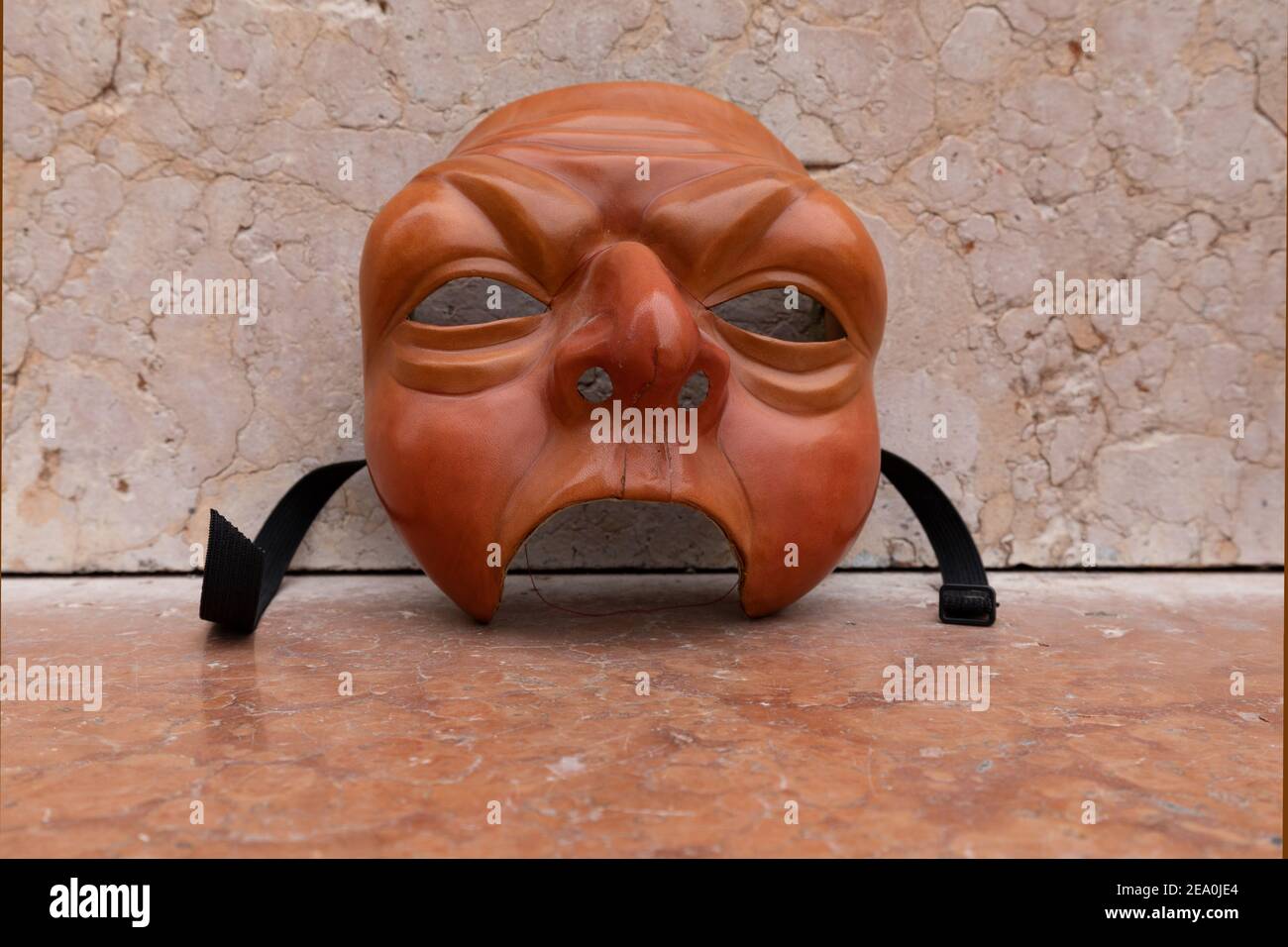 Venetian Zanni masks by artist Carlo Setti. This is a leather mask of a typical servant character portrayed in Commedia Dell'Arte theatre. Stock Photo
