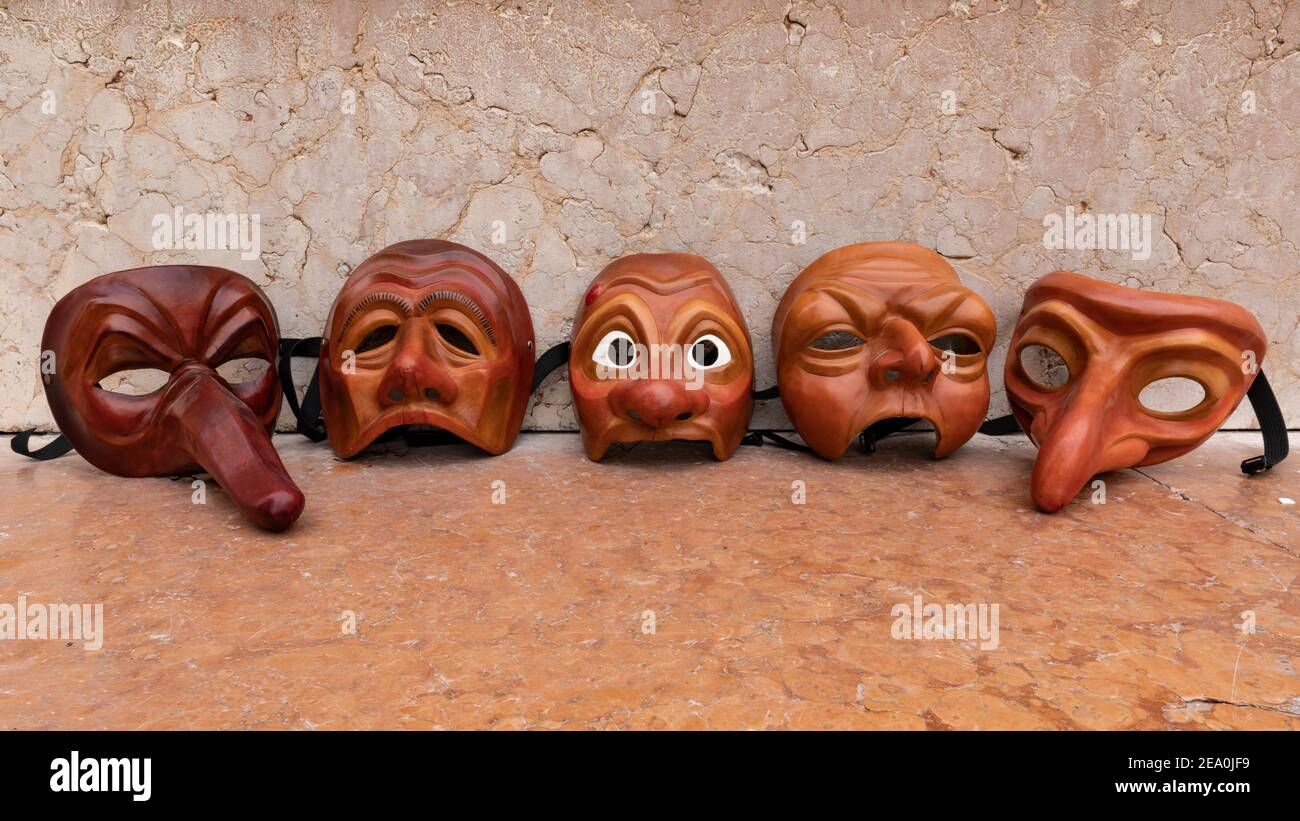Venetian Zanni masks by artist Carlo Setti. Leather mask of typical servant characters portrayed in Commedia Dell'Arte theatre. Stock Photo