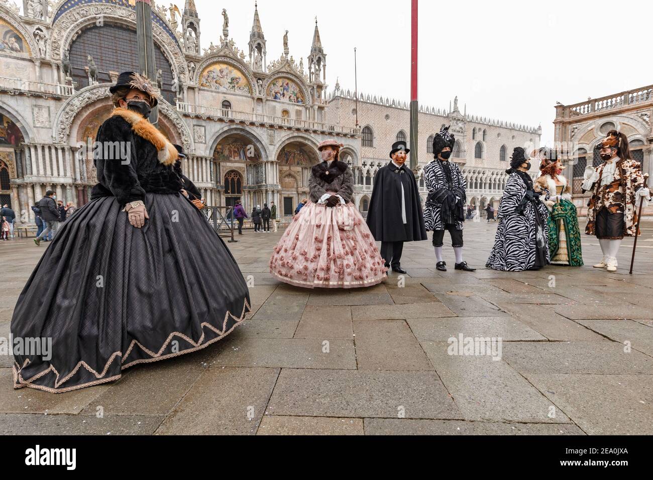 Unique Venetian carnival during the continuing pandemic restrictions in Italy February 2021 where citizens took to St Marks Square in regalia Stock Photo