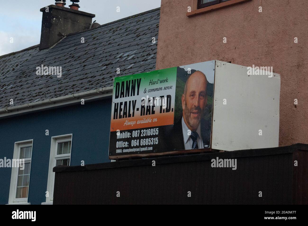 Kilgarvan, Co. Kerry, Ireland. 6th February, 2021. Kerry Council is seeking an order to remove signs erected by Kerry TDs Michael and Danny Healy Rae. The signs, above the porch of Danny's bar, once owned by his late Father Jackie, and another on a building  next to his brother Michael's service station in Kilgarvan, are, according to Kerry County Council, are in contravention of section 160 of the Planning and Development Act 2000. The brothers have not commented on the case. Credit Evan Doak/Alamy Live News Stock Photo