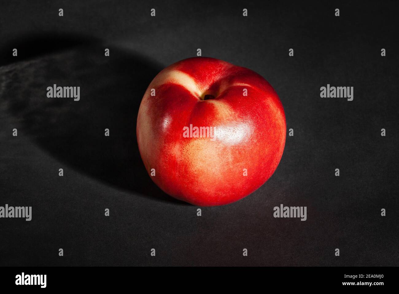 white nectarine on black background Stock Photo