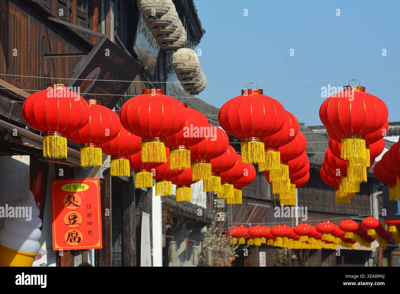 Red lanterns and Chinese New Year lanterns in Jiaxing,China. 2021 year of the ox. Shops and streets all colourfully decorated to celebrate. Stock Photo