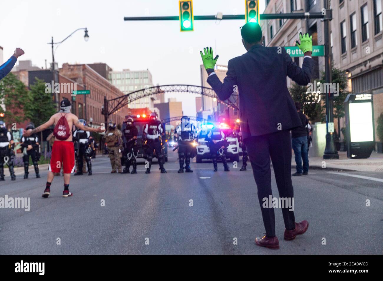 Revelation Sanders, 19, of Cleveland, Ohio and other protesters raises their hands while chanting slogans during the demonstration.Five days after the death of George Floyd at the hands of Minneapolis Police Officer Derek Chauvin Columbus, Ohio declared a state of emergency and imposed a curfew from 10pm to 6am to deal with the large scale protests happening in the city. The Ohio National Guard were called in at 3pm to help quell the protests and stop any rioting. National Guard and Riot officers pushed protesters north on High St. tear gassing and arresting protesters. Stock Photo