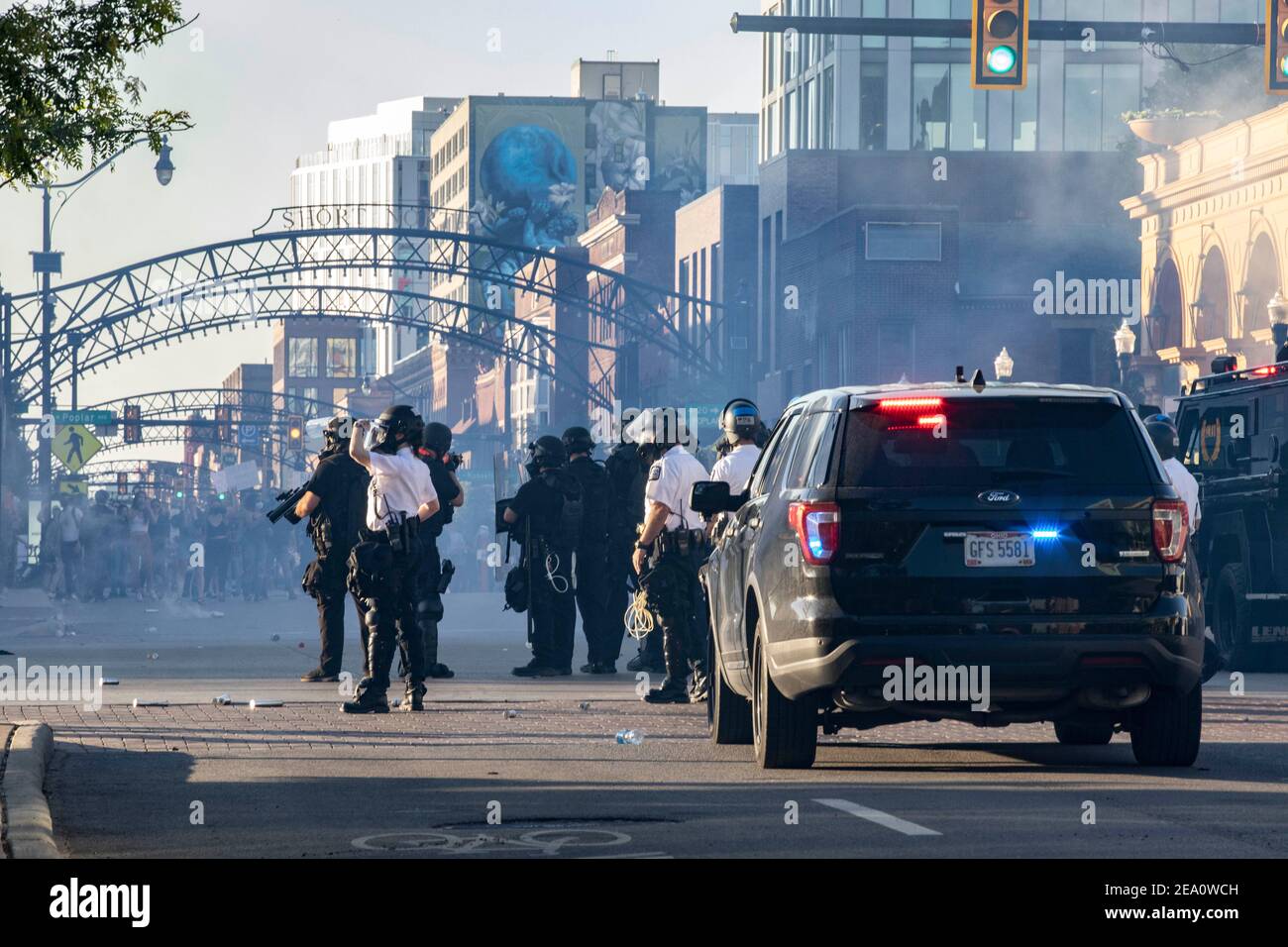 Columbus Police and SWAT officers fire tear gas canisters to disperse protesters during the demonstration.Five days after the death of George Floyd at the hands of Minneapolis Police Officer Derek Chauvin Columbus, Ohio declared a state of emergency and imposed a curfew from 10pm to 6am to deal with the large scale protests happening in the city. The Ohio National Guard were called in at 3pm to help quell the protests and stop any rioting. National Guard and Riot officers pushed protesters north on High St. tear gassing and arresting protesters. Stock Photo