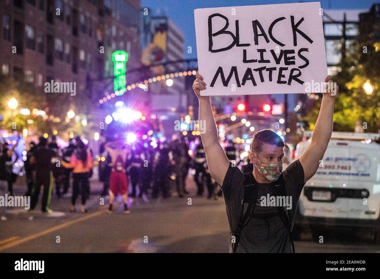 A protester holds a placard that says Black Lives Matter during the demonstration.Five days after the death of George Floyd at the hands of Minneapolis Police Officer Derek Chauvin Columbus, Ohio declared a state of emergency and imposed a curfew from 10pm to 6am to deal with the large scale protests happening in the city. The Ohio National Guard were called in at 3pm to help quell the protests and stop any rioting. National Guard and Riot officers pushed protesters north on High St. tear gassing and arresting protesters. Stock Photo