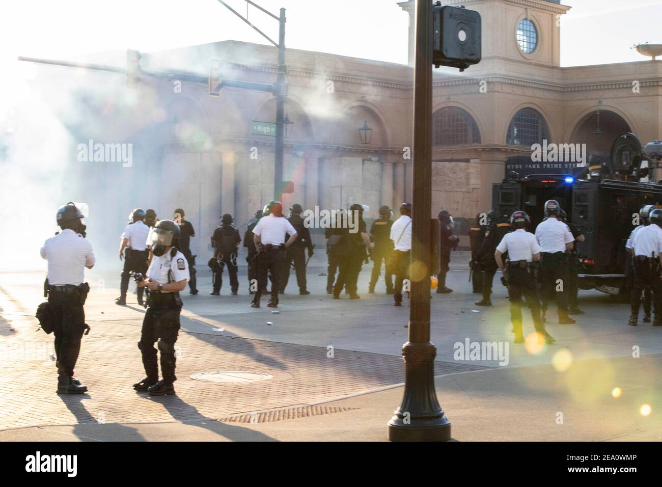 Columbus, Ohio, USA. 30th May, 2020. Columbus Police officers form two distinct lines pushing protesters north on High St. and West on Goodale St during the demonstration.Five days after the death of George Floyd at the hands of Minneapolis Police Officer Derek Chauvin Columbus, Ohio declared a state of emergency and imposed a curfew from 10pm to 6am to deal with the large scale protests happening in the city. The Ohio National Guard were called in at 3pm to help quell the protests and stop any rioting. National Guard and Riot officers pushed protesters north on High St. tear gassing Stock Photo