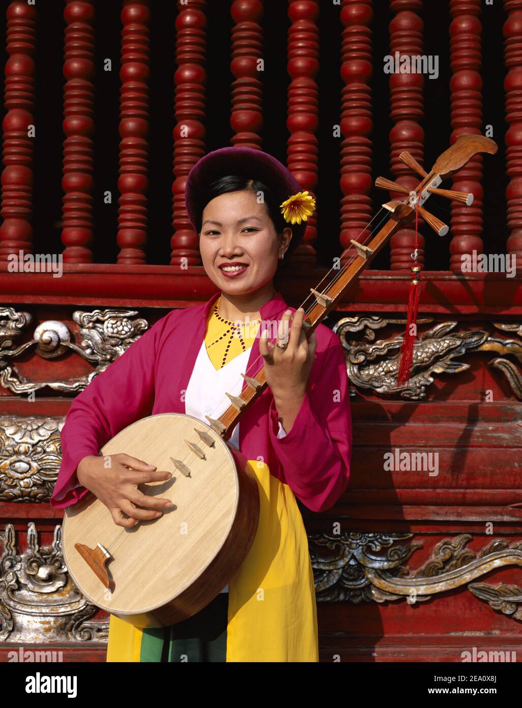 Asia Vietnam, Hanoi, Temple of Literature, Woman wearing vietnamese