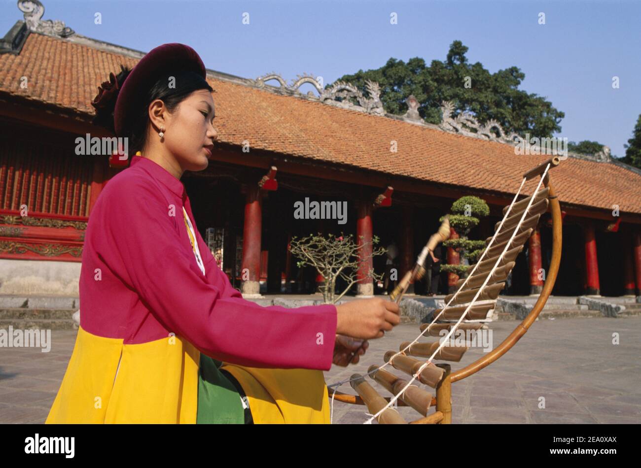 Vietnam, Hanoi, Temple of Literature,Vietnamese Woman wearing national