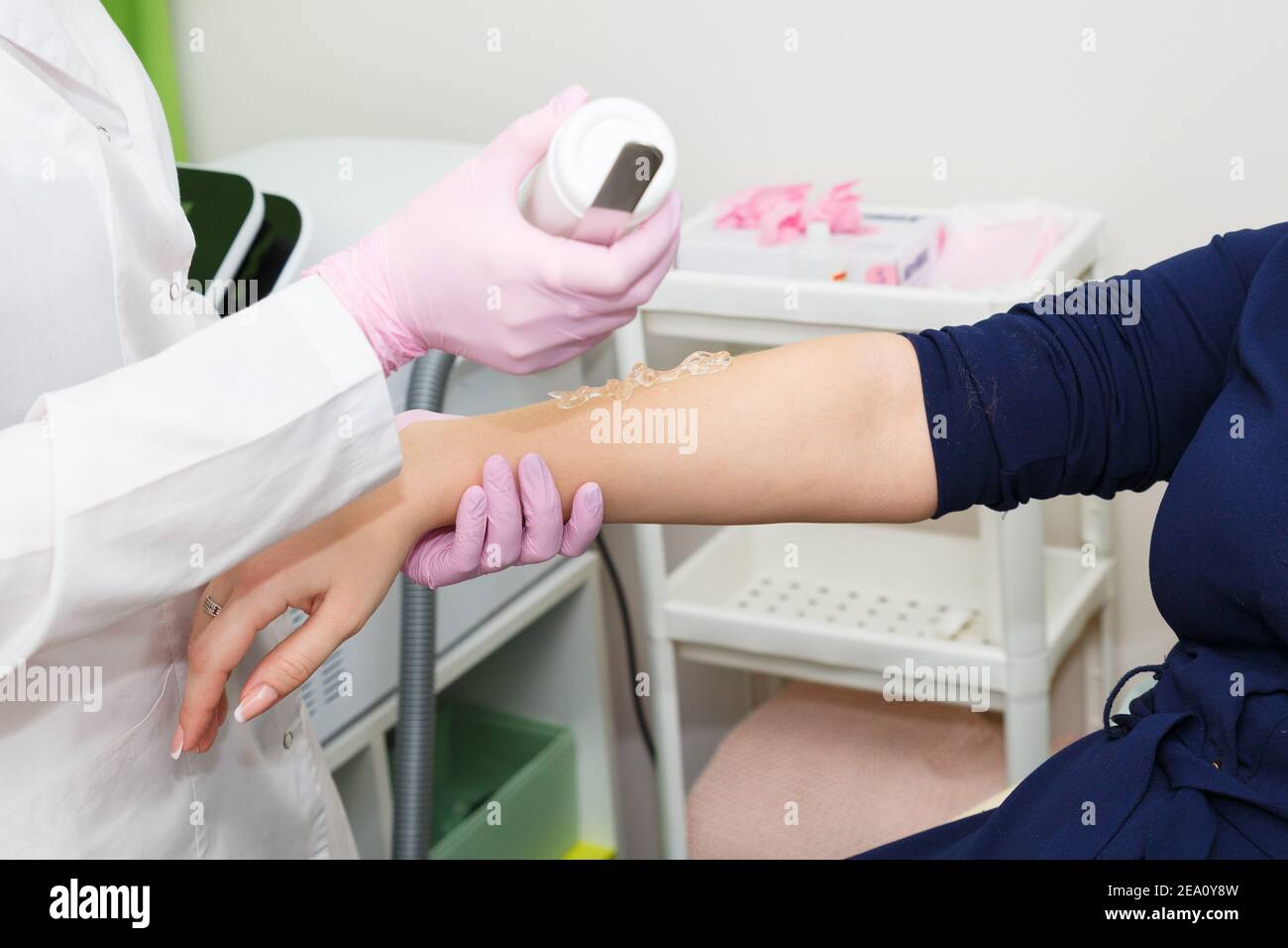 The cosmetologist applies contact gel to the skin of the hand before laser hair removal Stock Photo - Alamy The cosmetologist applies contact gel to the skin of the hand before laser hair removal Stock Photo - Alamy