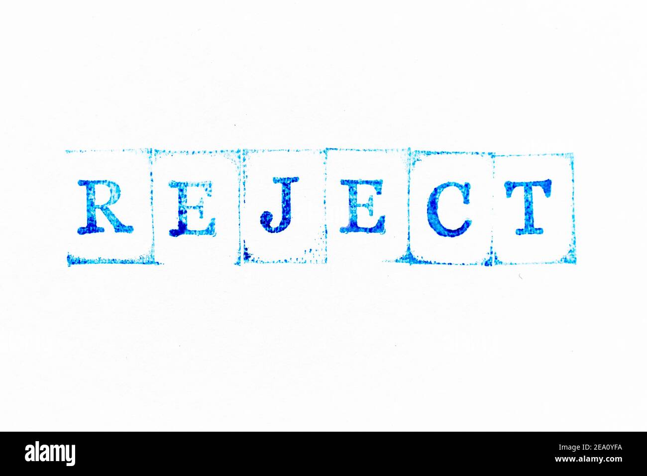 Blue color ink rubber stamp in word reject on white paper background ...