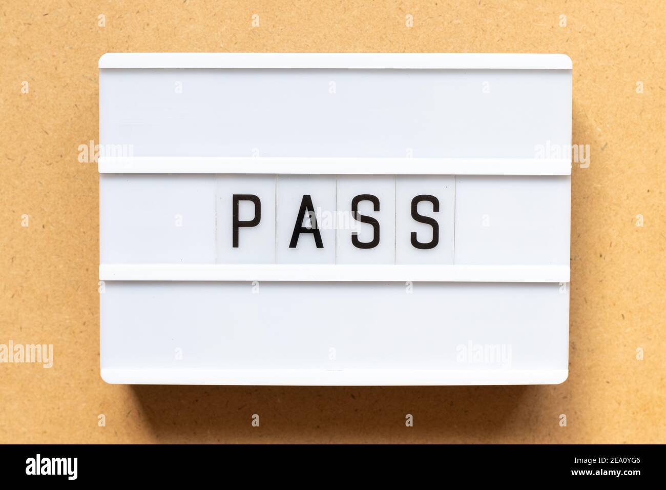 Lightbox with word pass on wood background Stock Photo