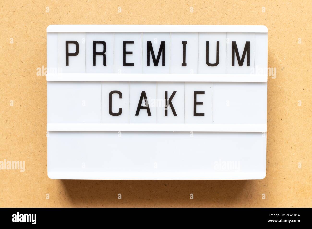 Lightbox with word premium cake on wood background Stock Photo