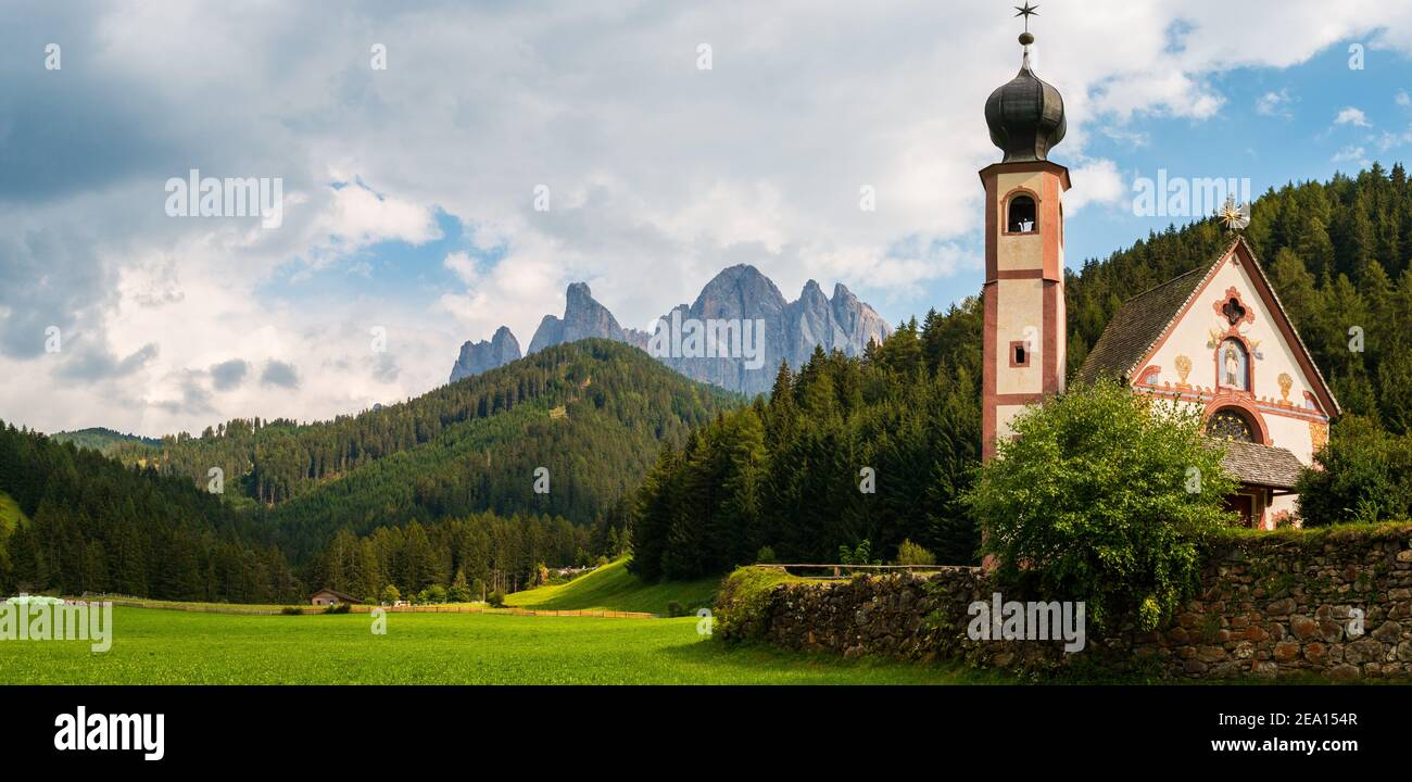 The world famous church in the prairie, San Giovanni in Ranui in Santa Maddalena of the Funes Valley, Trentino Alto Adige, Italy Stock Photo