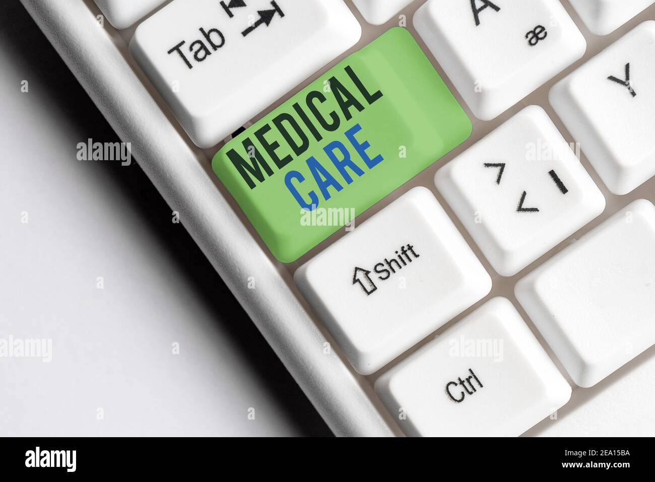 Writing note showing Medical Care. Business concept for the professional attention of medical practitioners in health Colored keyboard key with access Stock Photo