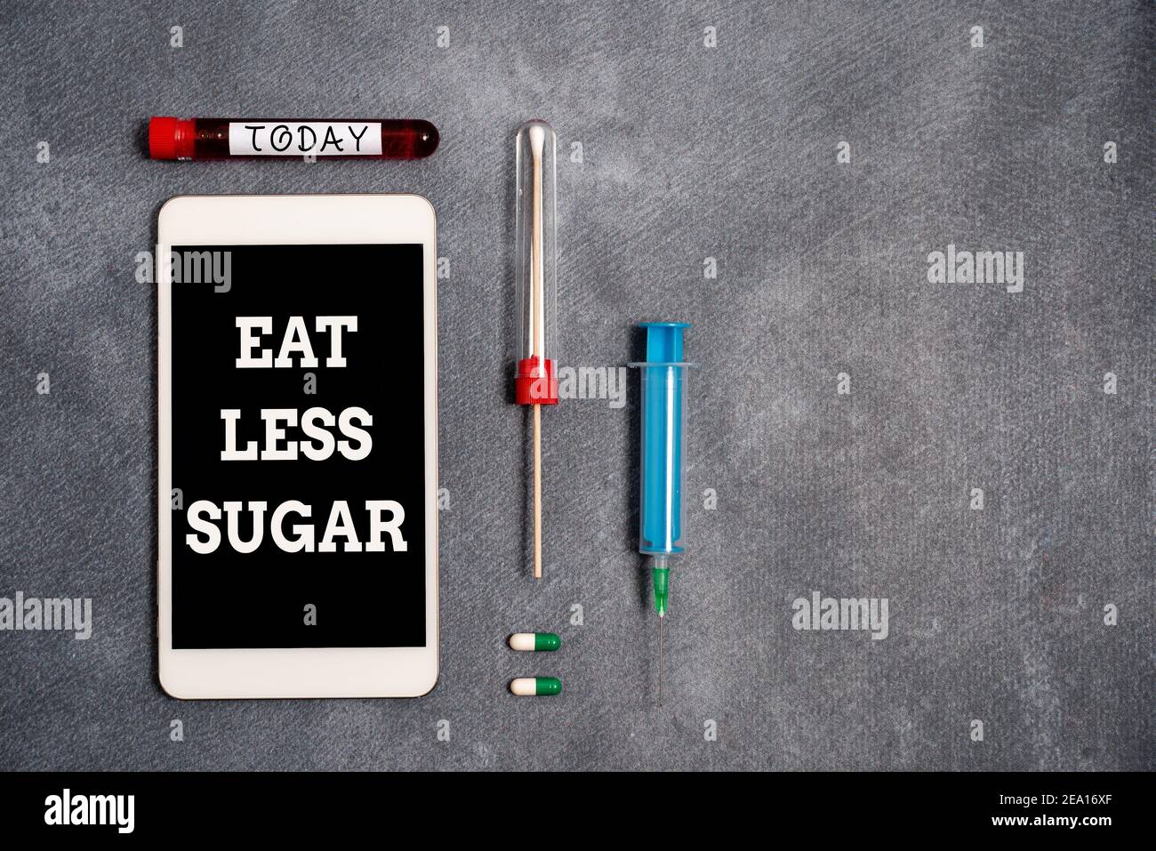 Conceptual hand writing showing Eat Less Sugar. Concept meaning reducing sugar intake and eating a healthful diet rich foods Blood sample vial medical Stock Photo