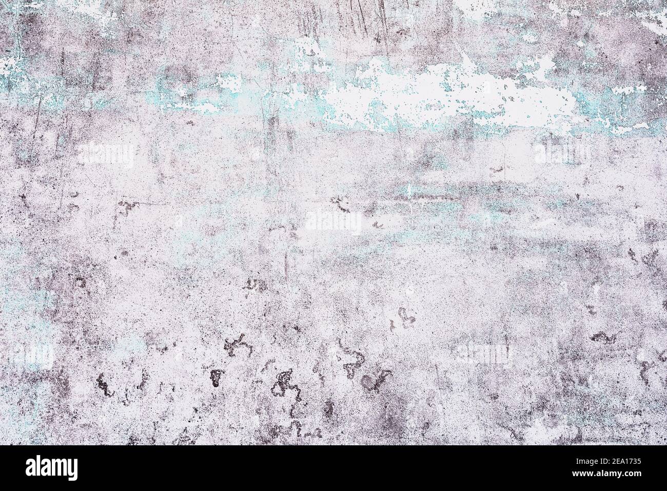 Old white with blue texture peeling off concrete wall Stock Photo