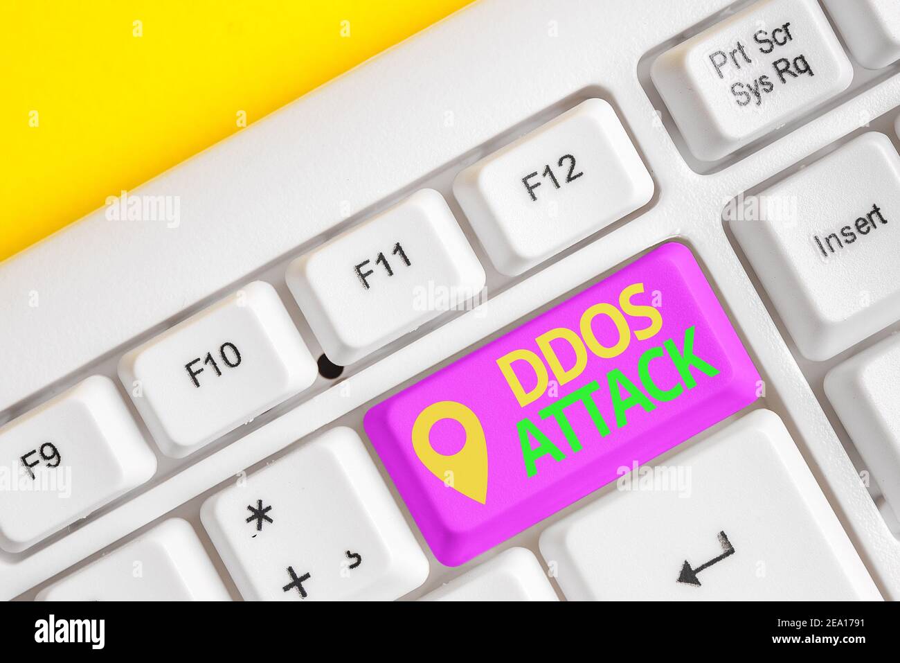 Handwriting text writing Ddos Attack. Conceptual photo perpetrator seeks to make network resource unavailable Different colored keyboard key with acce Stock Photo