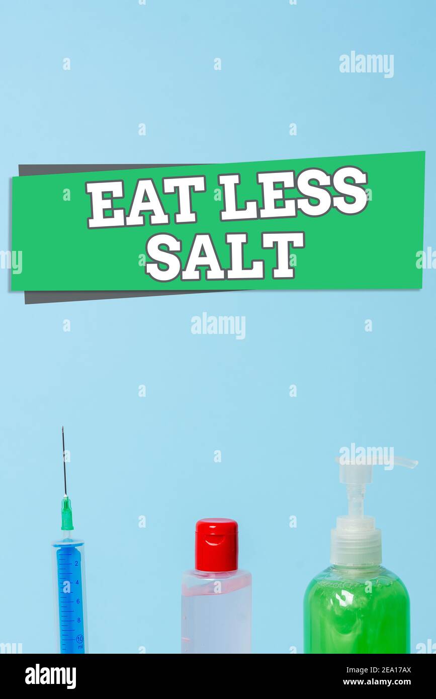 Word writing text Eat Less Salt. Business photo showcasing reducing the sodium intake on the food and beverages Primary medical precautionary equipmen Stock Photo