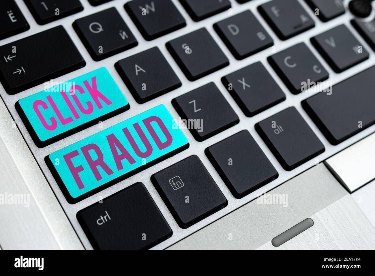Writing note showing Click Fraud. Business concept for practice of repeatedly clicking on advertisement hosted website Different Colored PC keyboard k Stock Photo