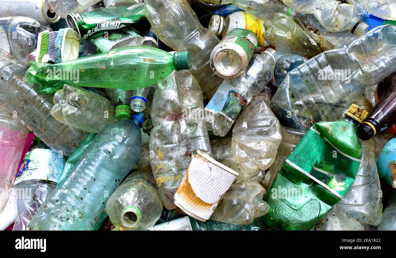 Pile of waste plastic bottles, aluminium can from drinking and paper