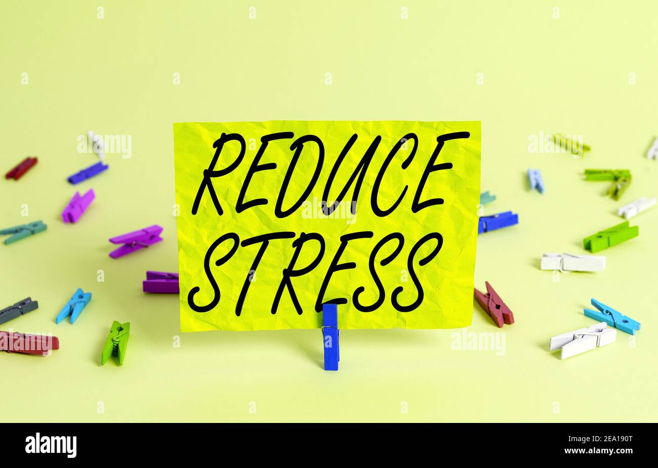 Text sign showing Reduce Stress. Business photo text to lessen the state of mental or emotional strain or tension Colored crumpled rectangle shaped re Stock Photo