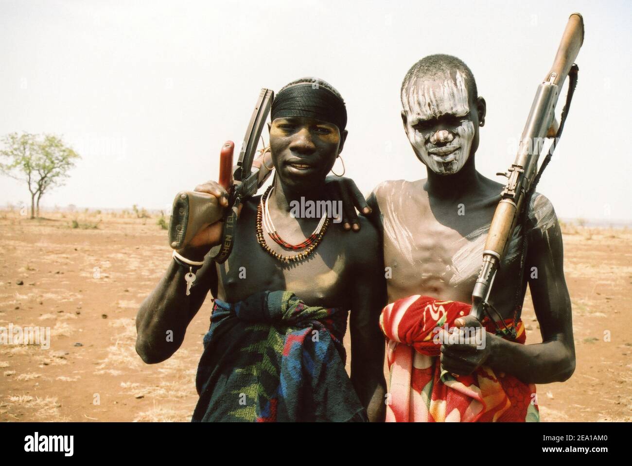 Mursi Warriors Carrying Kalashnikovs Stock Photo