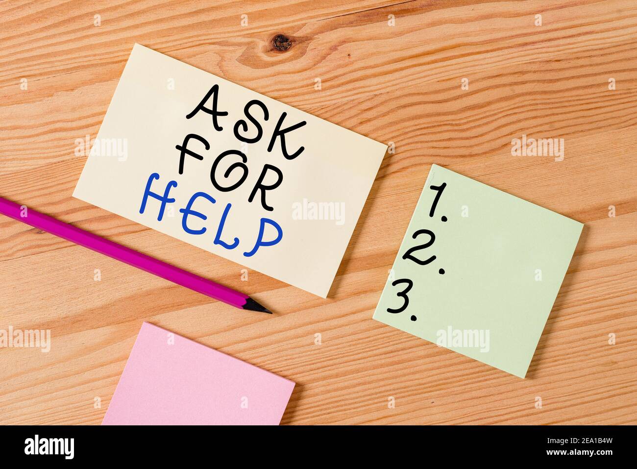 Text sign showing Ask For Help. Business photo text put a question or seek an answer or assistance from someone Colored clothespin papers empty remind Stock Photo