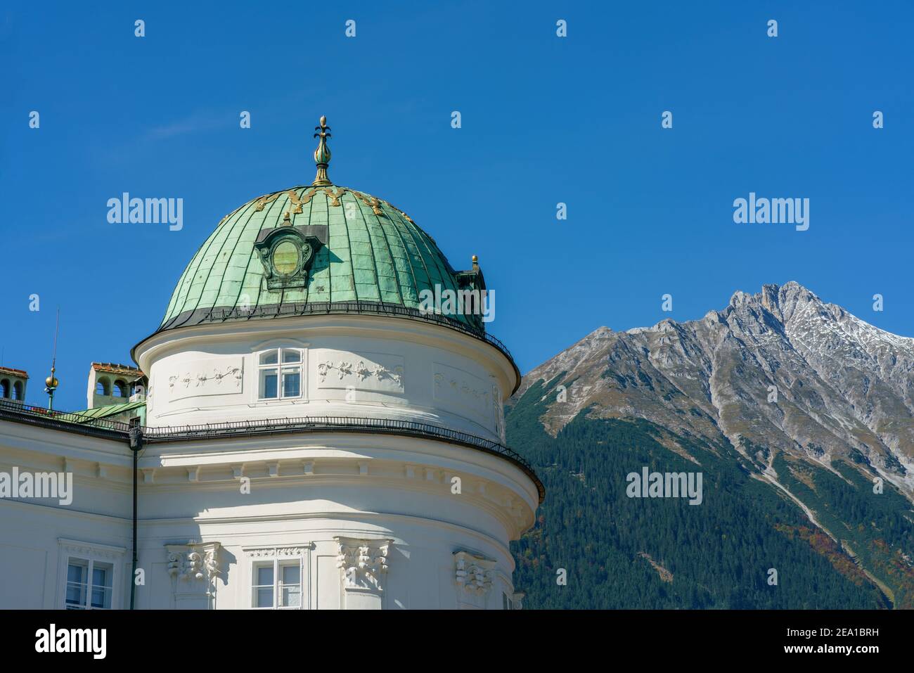 Innsbruck, Austria- october 11, 2019:  Green dome of the Kaiserliche Hofburg (imperial palace) in Innsbruck Austria against the mountain view Stock Photo