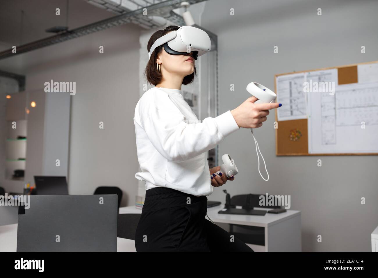 team of four creative engineers working with virtual reality, young ...