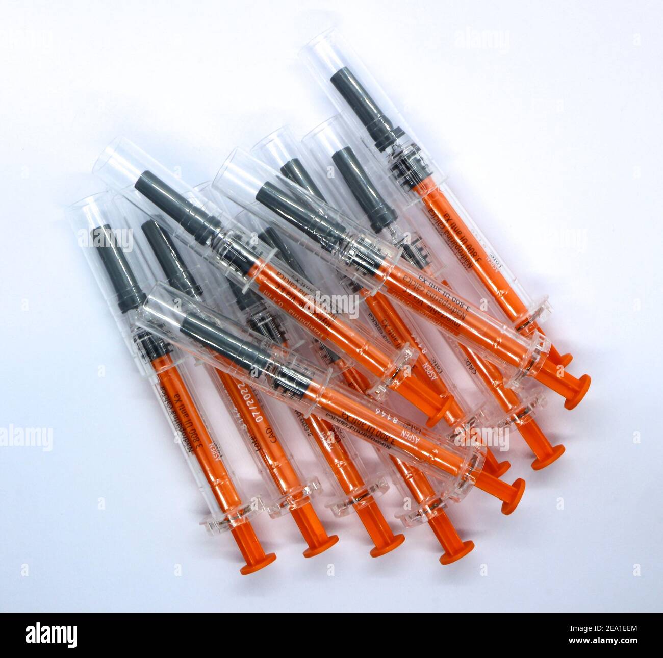 Transparent black and orange used plastic syringes pre filled with 0.4