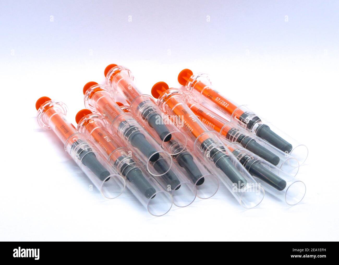 Transparent black and orange used plastic syringes pre filled with 0.4