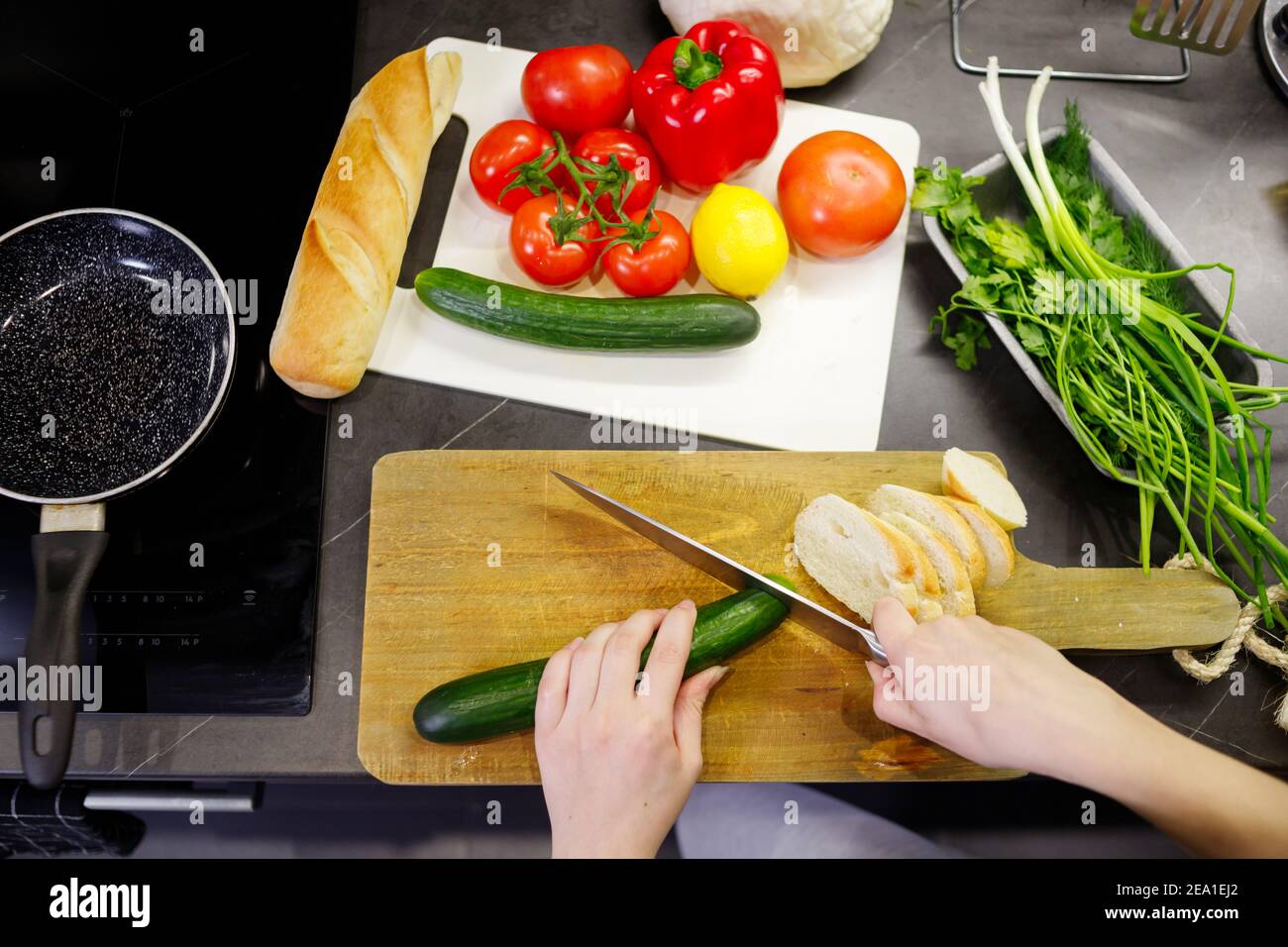 Woman cutting vegetables in kitchen. Top view Stock Photo Alamy