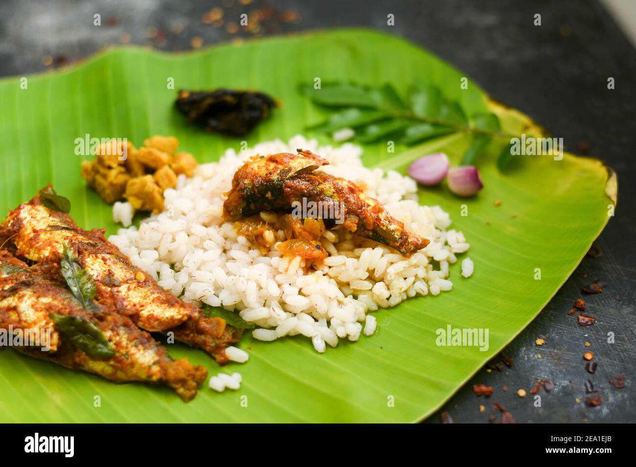 Top view Sardine fish curry spicy Woman hand take Kerala fish curry