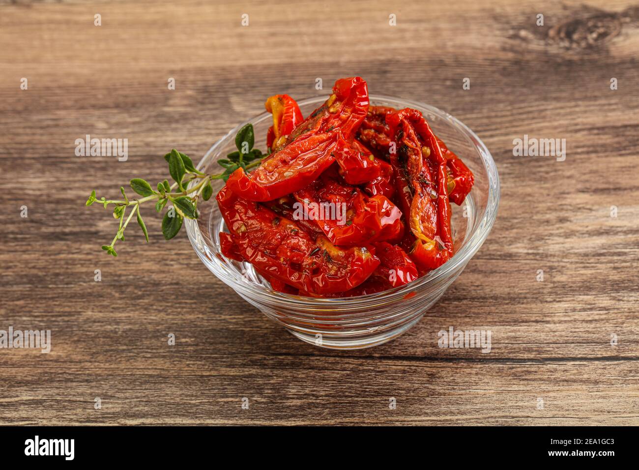 Sundried tomato in olive oil with herbs and spices Stock Photo Alamy