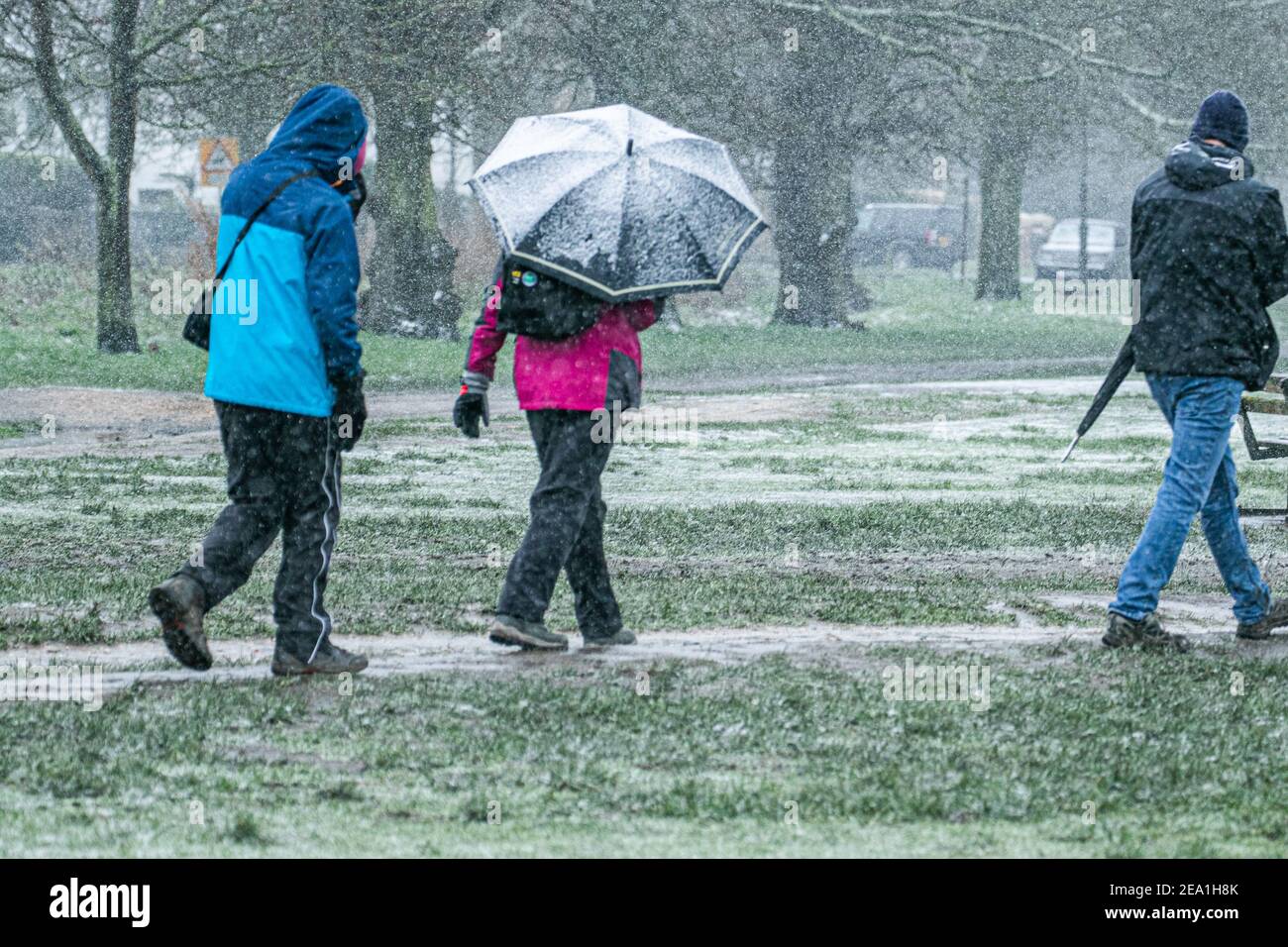 Wimbledon London Uk 7 February 21 Pedestrians Walk Through Wimbledon Common During A Snow Shower As Storm Darcy Hits The Uk This Morning With Freezing Temperatures The Met Office Has Issued Yellow Wimbledon London Uk 7 February 21 Pedestrians Walk Through Wimbledon Common During A Snow Shower As Storm Darcy Hits The Uk This Morning With Freezing Temperatures The Met Office Has Issued Yellow